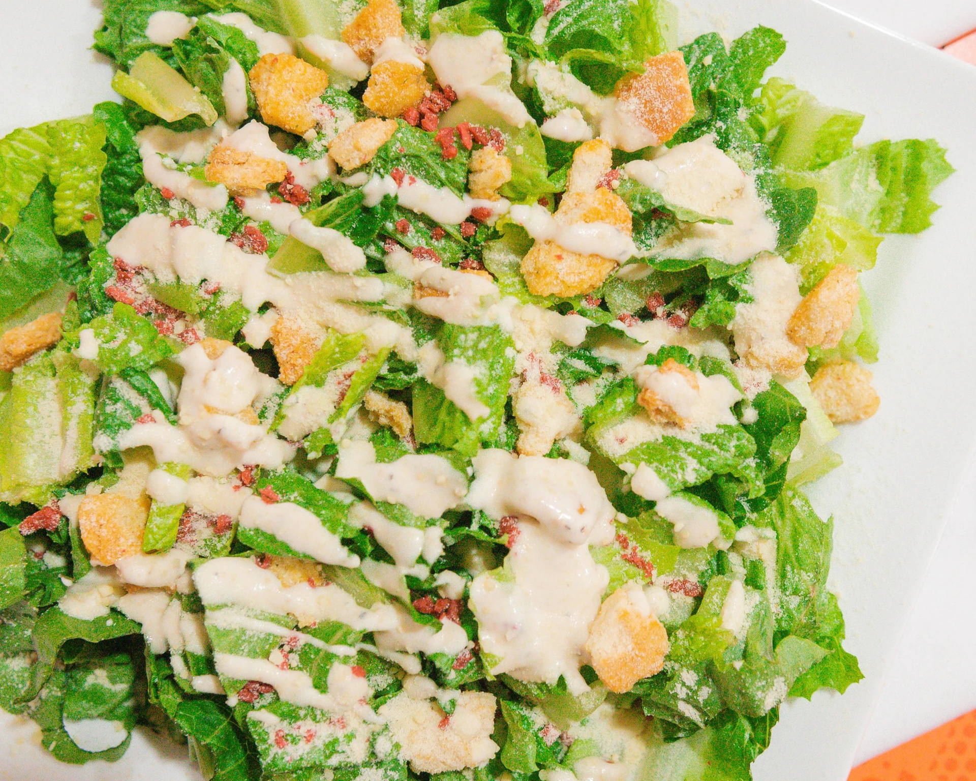 Caesar salad with romaine, parmesan, croutons and creamy Caesar dressing at our Edmonton halal pizza and donair shop