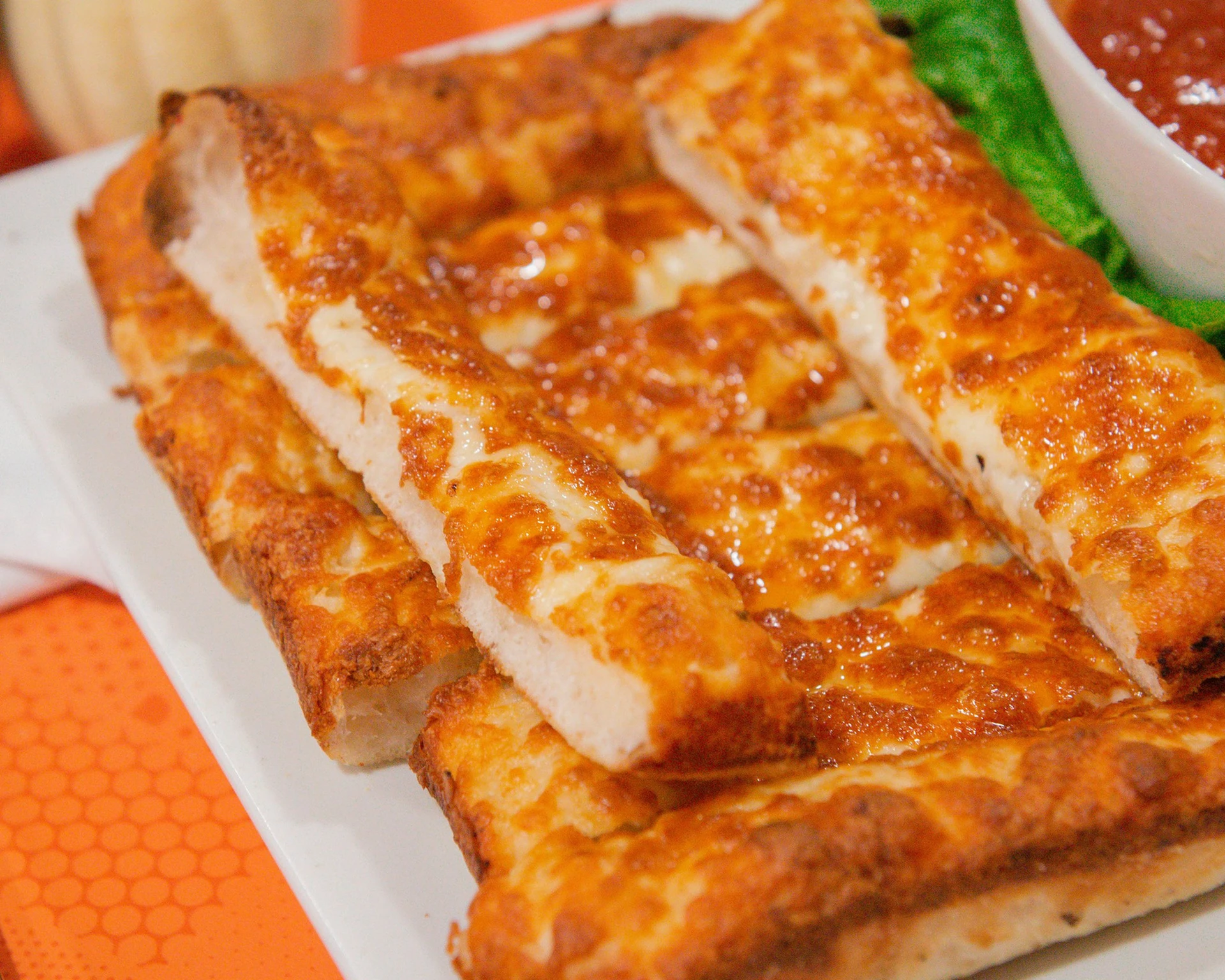 Garlic cheese bread baked with melted mozzarella and served with marinara at Canadian Choice Pizza and Donairs in Edmonton